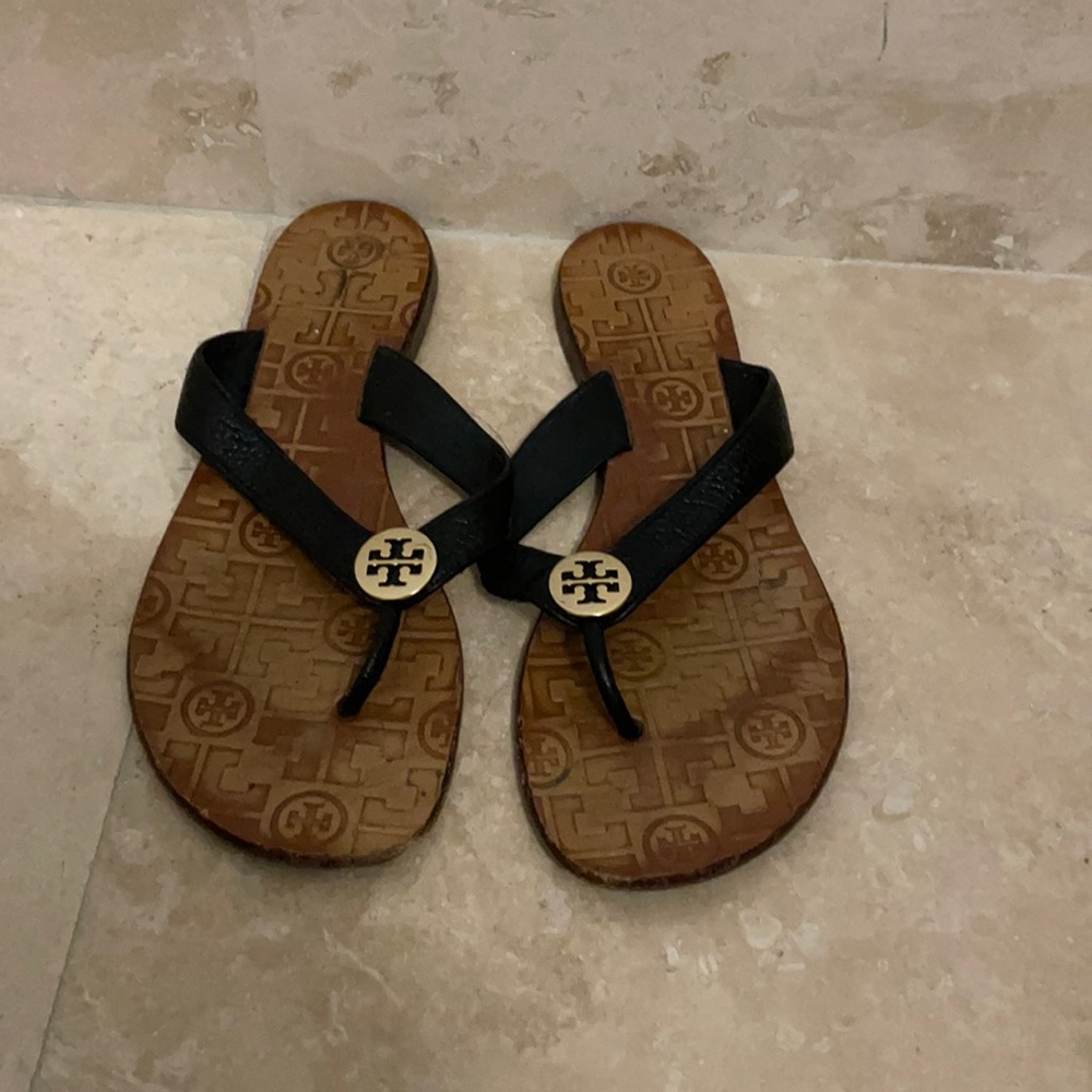 Tory Burch black leather slides with gold emblem
